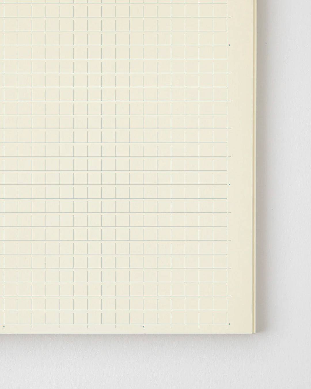 A5 grid paper notebook with a simple and clean off white cover and embossed MD Paper logo.