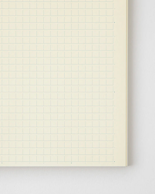A5 grid paper notebook with a simple and clean off white cover and embossed MD Paper logo.