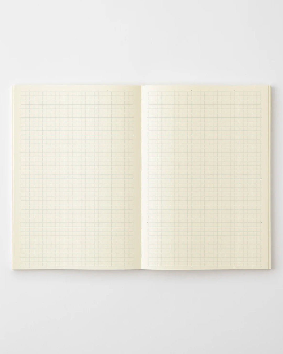 A5 grid paper notebook with a simple and clean off white cover and embossed MD Paper logo.