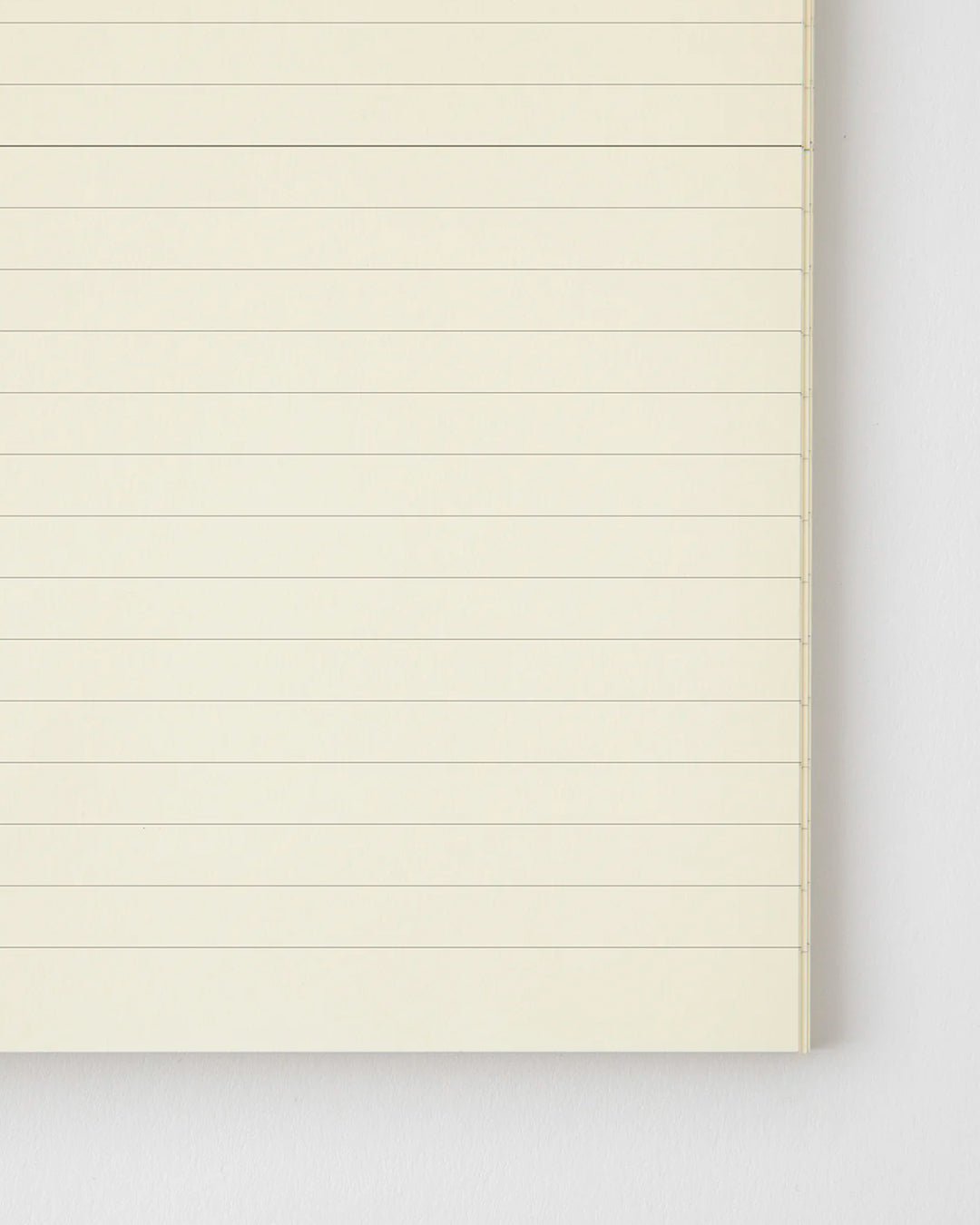 A5 ruled paper notebook with a simple and clean off white cover and embossed MD Paper logo.