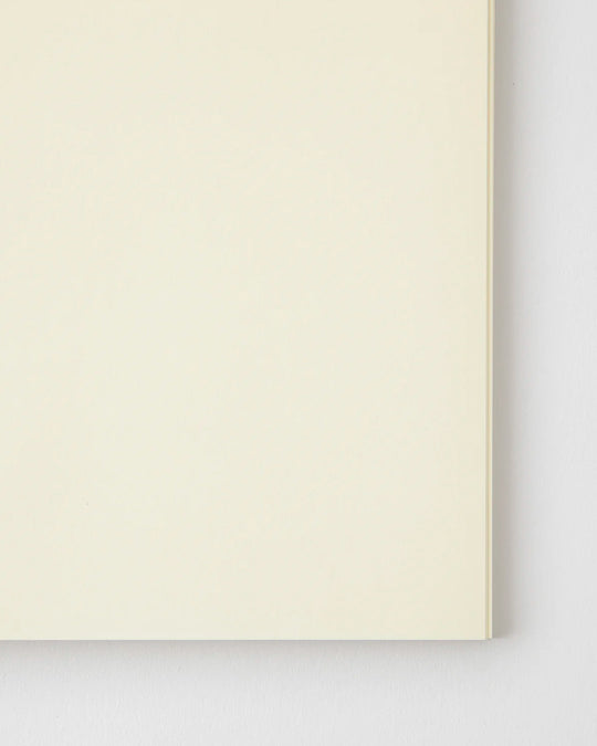 A5 plain paper notebook with a simple and clean off white cover and embossed MD Paper logo.