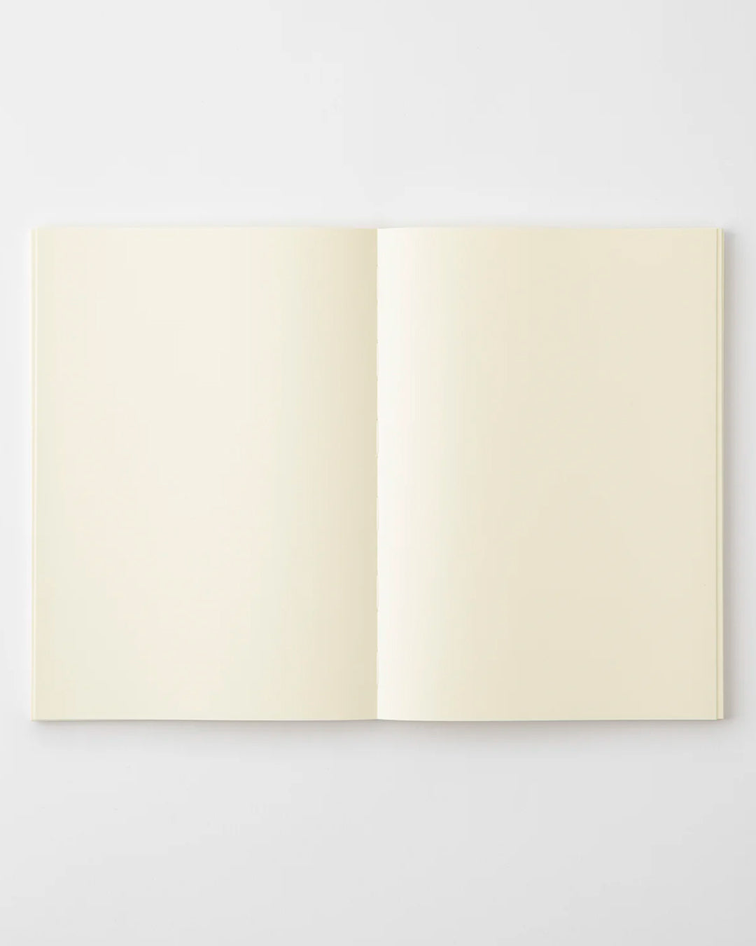 A5 plain paper notebook with a simple and clean off white cover and embossed MD Paper logo.