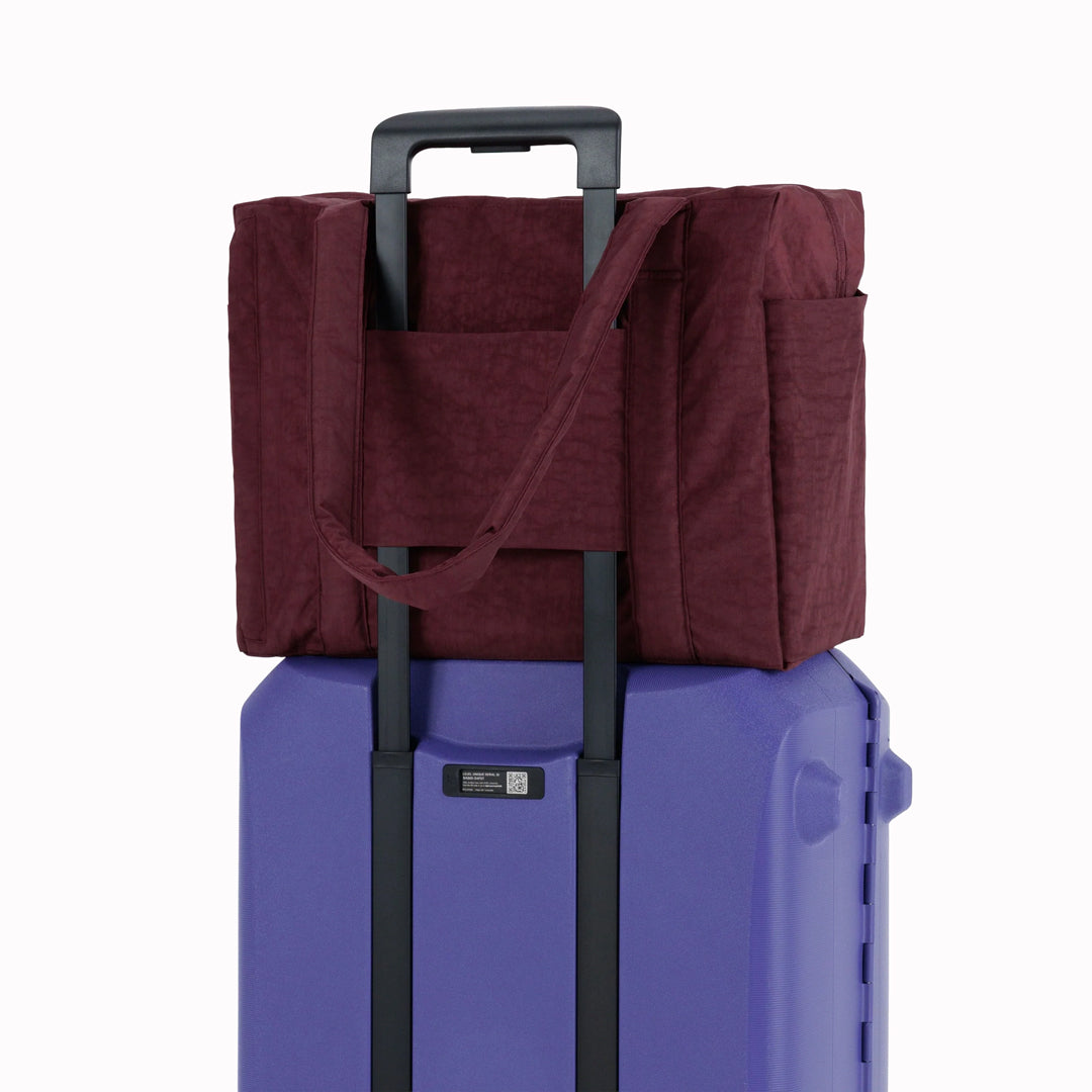 The small 'Cloud' Carry-On from Baggu is constructed from durable heavyweight nylon. Its versatile design has been optimised for air travel where its size allows it to fit under an aeroplane seat.