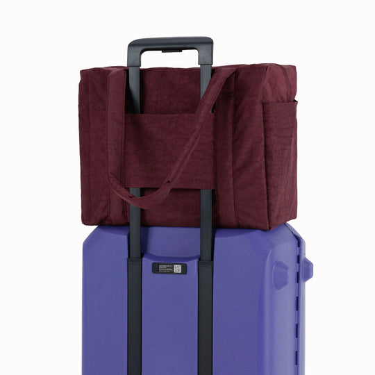 The small 'Cloud' Carry-On from Baggu is constructed from durable heavyweight nylon. Its versatile design has been optimised for air travel where its size allows it to fit under an aeroplane seat.