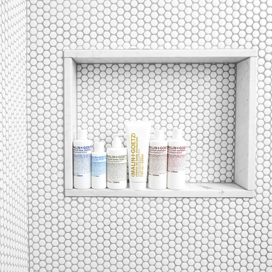 Shower room shot of Malin+Goetz Essentials Cleansing Collection