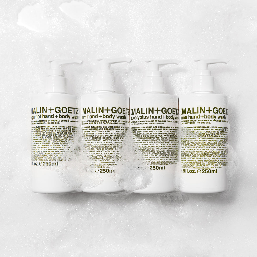 The Eucalyptus Hand + Body cleansing gel from Malin+Goetz on a foamy lather background