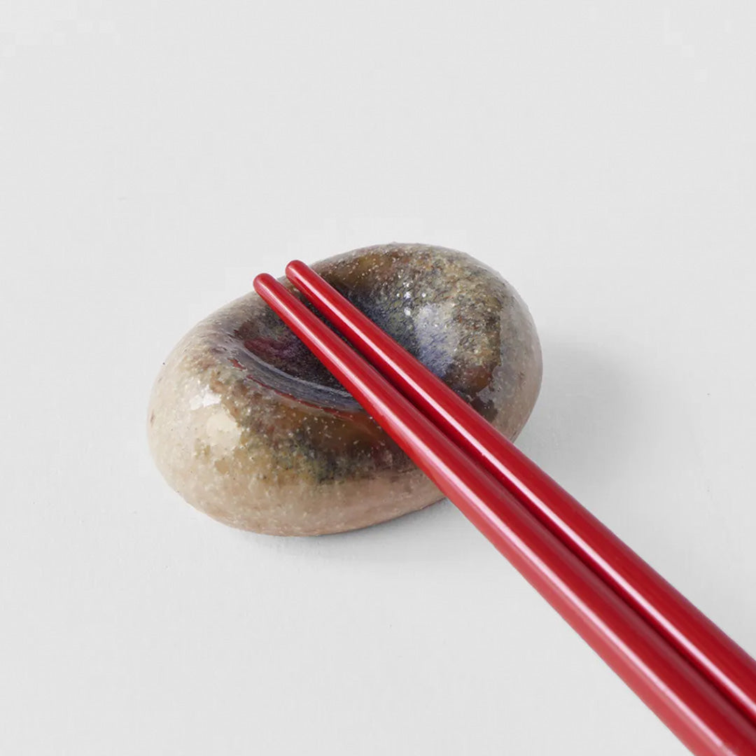 This brown/natural marbled ceramic pebble makes a perfect chopstick rest, inspired by the organic shape of river pebbles and has a mottled glaze.