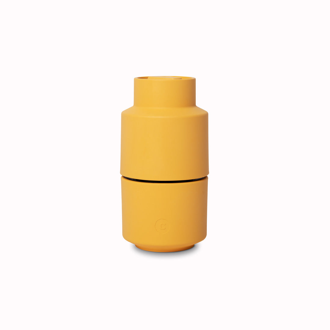 A rich yellow coloured Danish designed Billund spice grinder from CrushGrind is a 12cm tall upside-down grinder with a powerful ceramic grinding module that makes easy work of grinding salt, pepper, dried herbs and most spices.