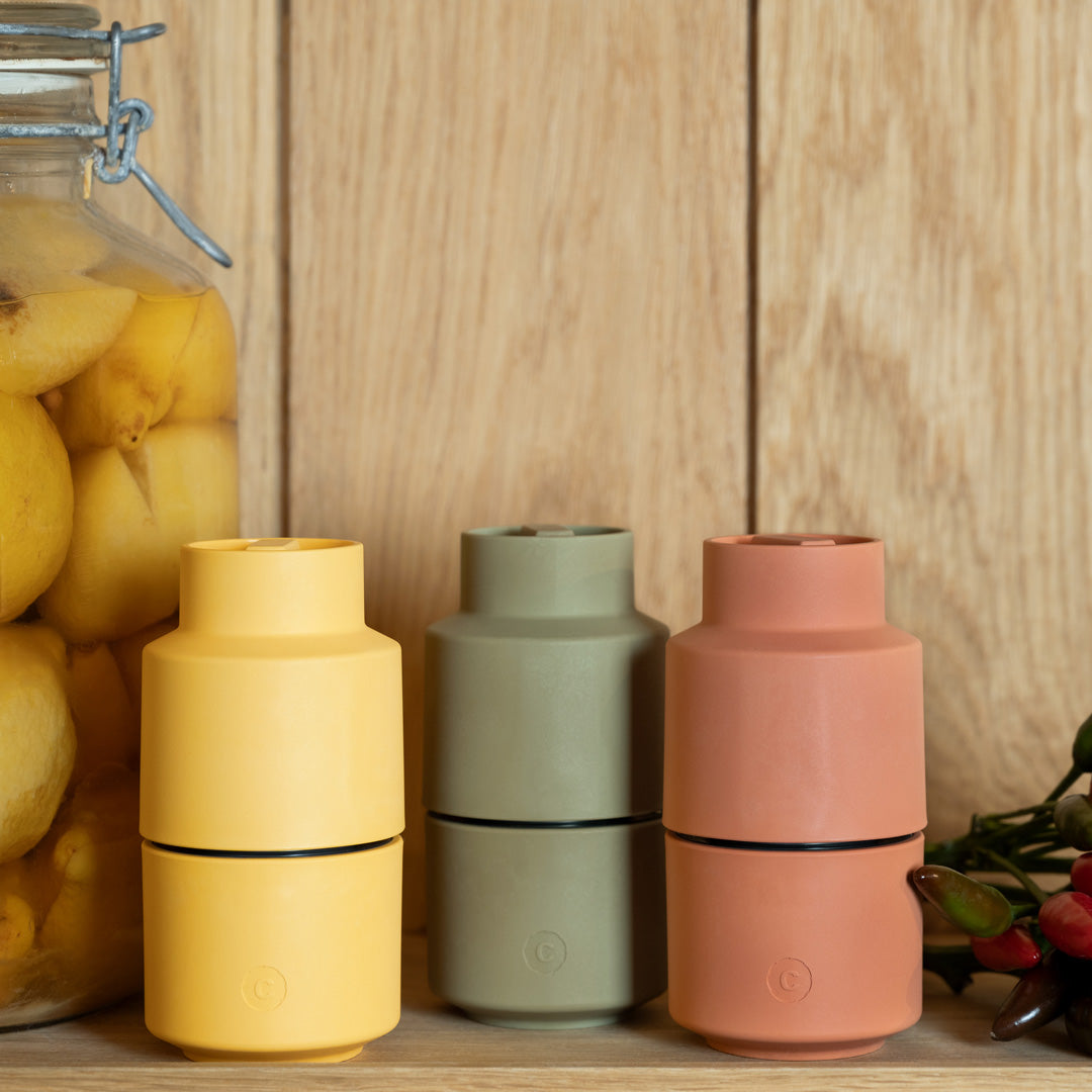 A rich yellow coloured Danish designed Billund spice grinder from CrushGrind is a 12cm tall upside-down grinder with a powerful ceramic grinding module that makes easy work of grinding salt, pepper, dried herbs and most spices.