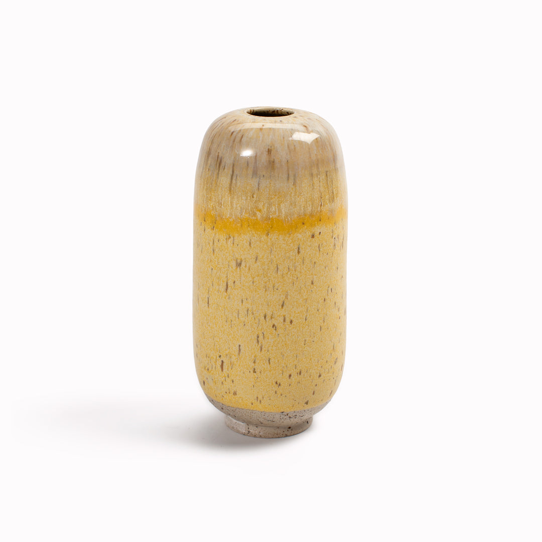 The Melting Daisy&nbsp;design is hand-thrown in watertight stoneware. Due to the rounded taper at the top of the vase