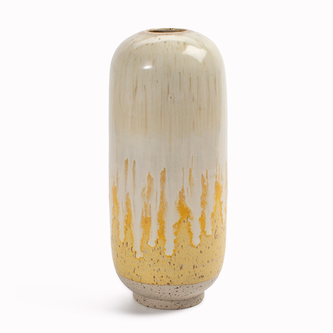 Studio Arhoj's Japanese inspired vases are named after the Japanese word for snow. The Melting Daisy design is hand-thrown in watertight stoneware. Due to the rounded taper at the top of the vase, the glaze melts down the sides of the cylindrical vase mimicking melting ice.
 