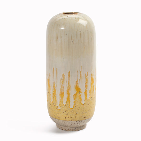 Studio Arhoj's Japanese inspired vases are named after the Japanese word for snow. The Melting Daisy design is hand-thrown in watertight stoneware. Due to the rounded taper at the top of the vase, the glaze melts down the sides of the cylindrical vase mimicking melting ice.
 