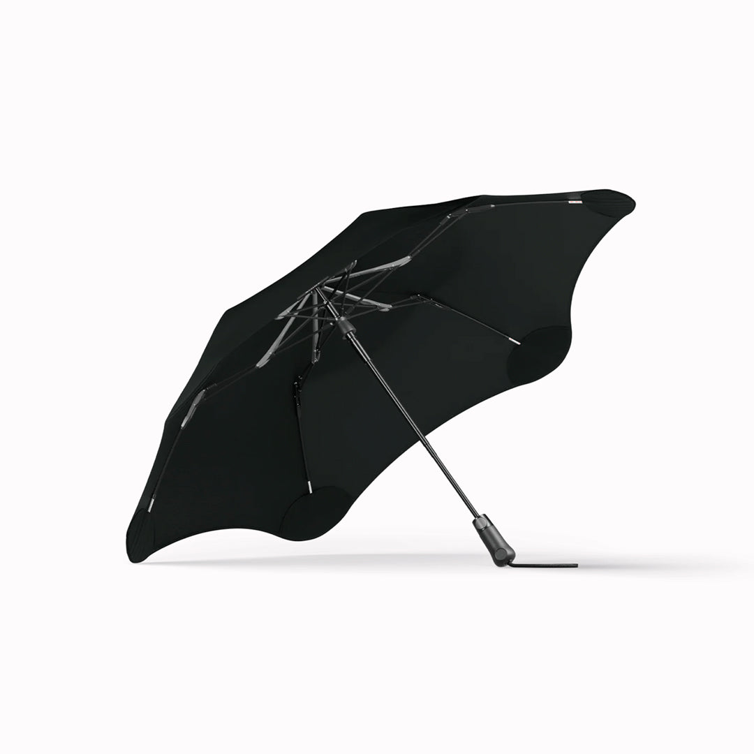 Crafted for portability and resilience, the Metro folding umbrella from Blunt is engineered to withstand challenging weather conditions.