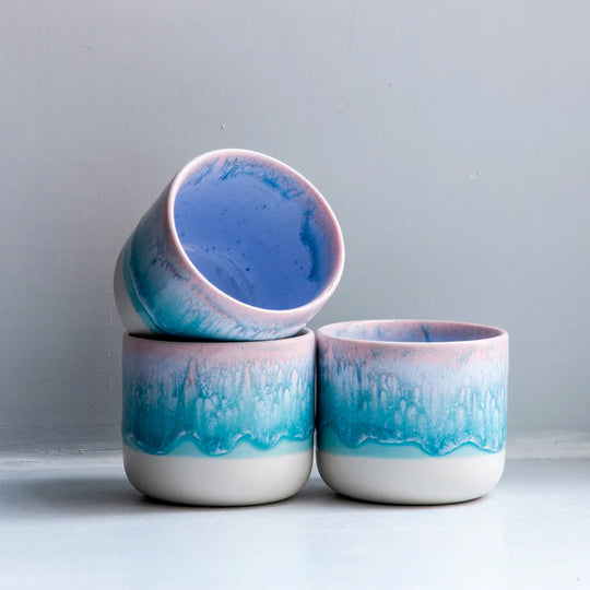 The pale blue over pink glaze Miami Sip Cup - Danish/Japanese mix up with this thick glazed, hand made ceramic small beaker from Studio Arhoj's Tokyo Series.