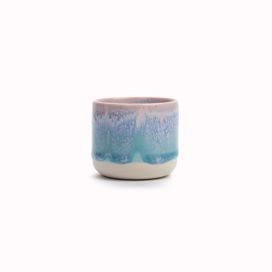 The pale blue over pink glaze Miami Sip Cup - Danish/Japanese mix up with this thick glazed, hand made ceramic small beaker from Studio Arhoj's Tokyo Series.