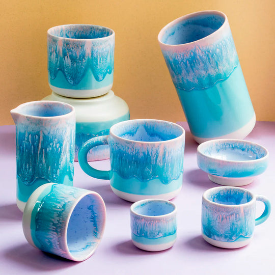 The pale blue over pink glaze Miami Sip Cup - Danish/Japanese mix up with this thick glazed, hand made ceramic small beaker from Studio Arhoj's Tokyo Series.