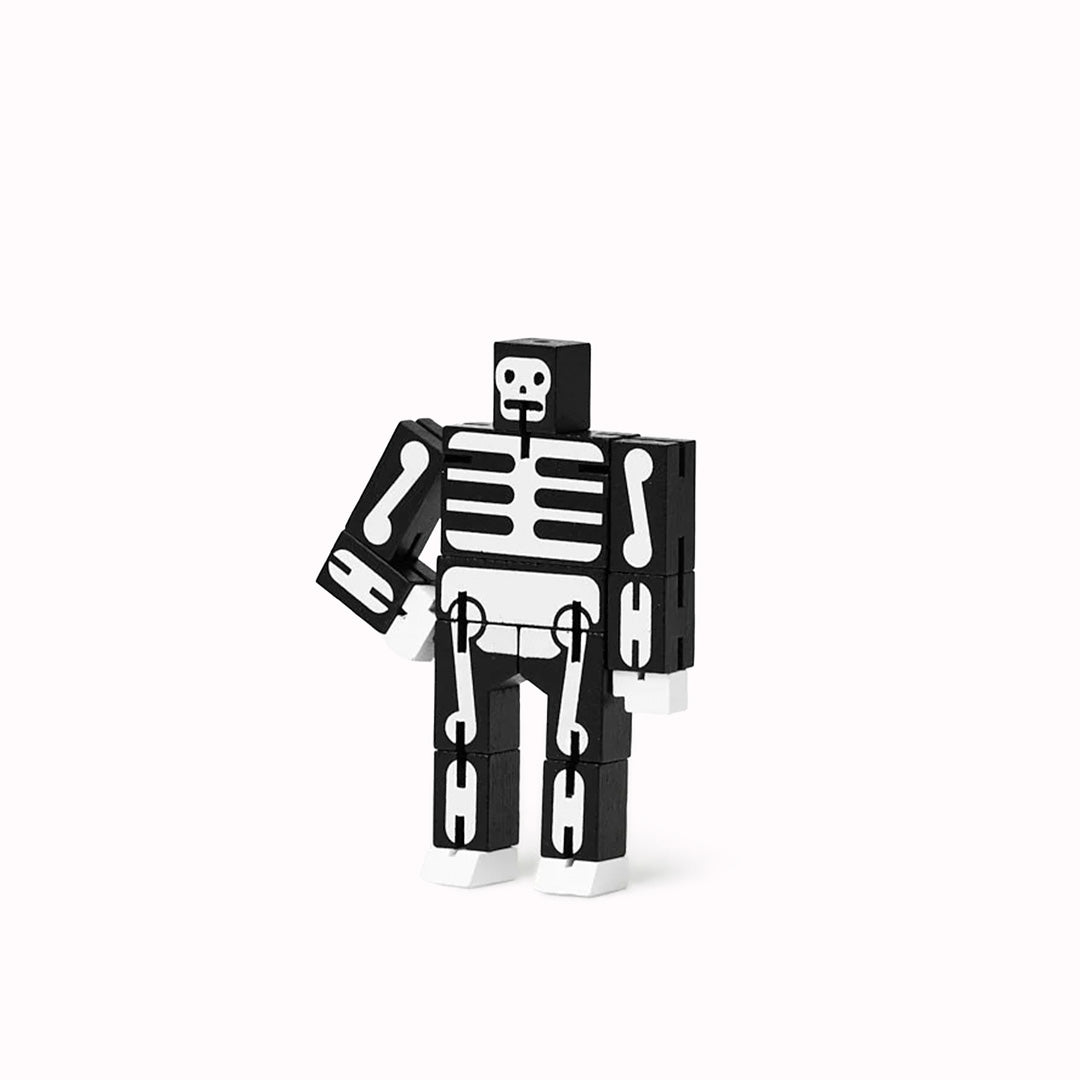 Cubebot is a fun wooden toy robot that folds out of a perfect cube shape. Part puzzle, part posable toy they are inspired by Japanese Shinto Kumi-ki puzzles and can be positioned to hold dozens of poses