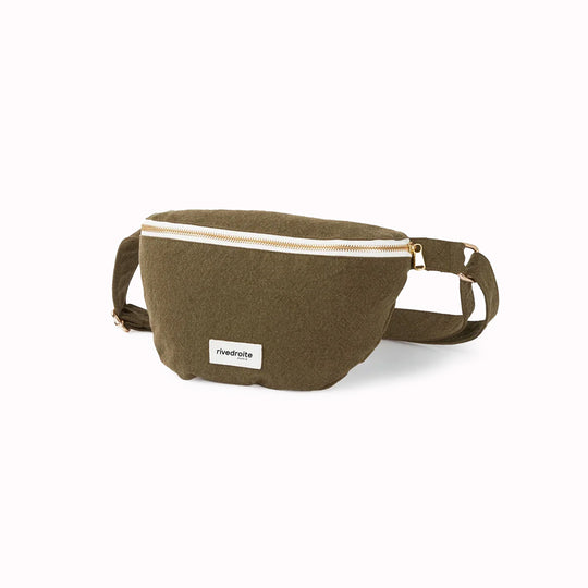 The Military Green Custine Belt Bag is a stylish and practical accessory crafted from upcycled denim. Designed by Rive Droite, a brand known for its commitment to sustainable fashion