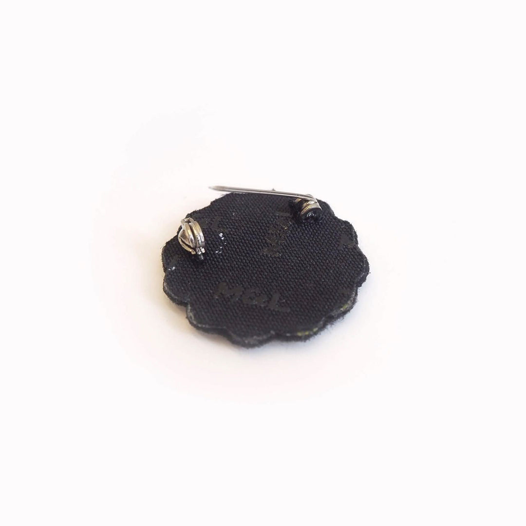 Hand-embroidered Mini Daisy lapel pin by Parisian fashion accessory brand Macon et Lesquoy. Measuring approximately 30mm by 30mm, the mini daisy brooch is part of their 'Timeless Creations' Collection