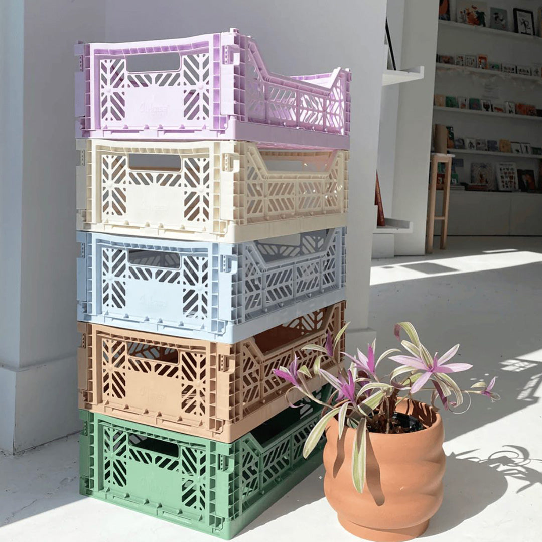 Pastel Shades Stack of Folding Crate from Aykasa. This crate is made from 100% recyclable material and can be folded flat when not in use. It's perfect for holding books, toys, clothes, or anything else you want to organise. 
