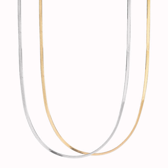 Mio Chain from Maria Black. Its sinuous, snake-like chain design drapes gracefully around the neck, creating a captivating visual statement. The adjustable length ensures a comfortable fit, allowing you to personalize your style.