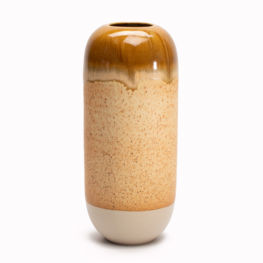 Mirrored Earth is an earthy brown hued Yuki Ceramic Vase <span data-mce-fragment="1">that is drip glazed and hand-thrown in watertight stoneware.