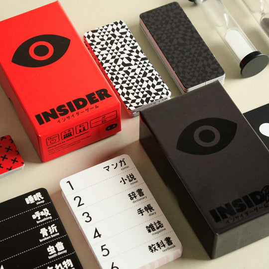 Insider Black and Insider Red boxes together laid out on table.