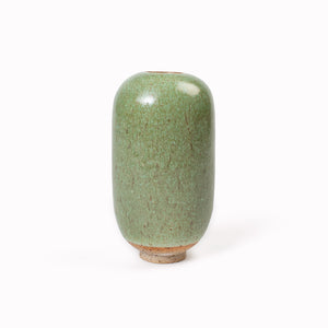 The Mountain Moss Mini Yuki Vase design is hand-thrown in watertight stoneware. Due to the rounded taper at the top of the vase, the glaze melts down the sides of the cylindrical vase mimicking melting ice.&nbsp;