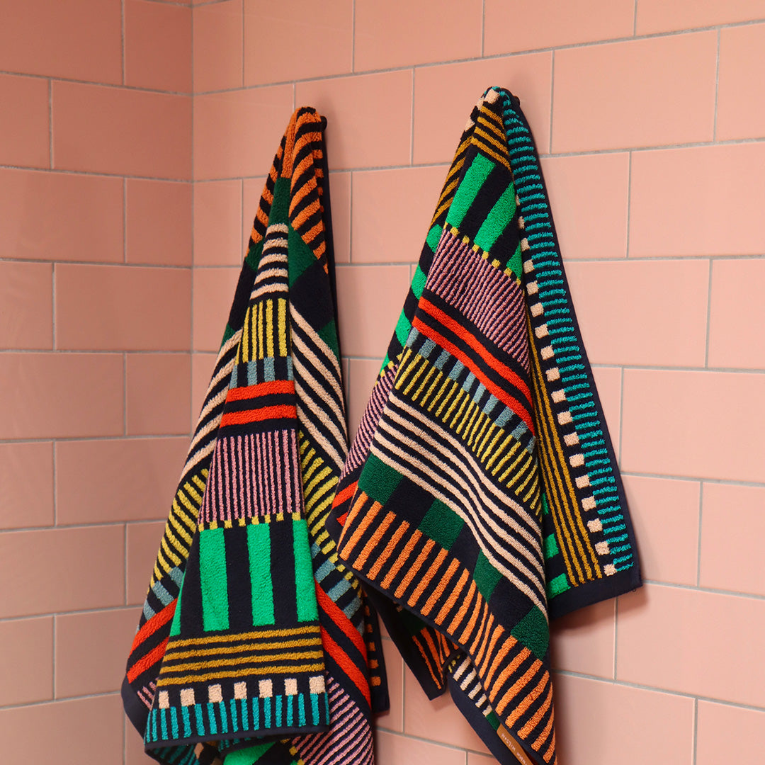 The Multi Stripe Collection of Towels from Donna Wilson are a kaleidoscope of colour and have a retro vibe that we love! The Face Cloth is 30 x 30cm and will add a splash of bold colour to the bathroom. Hanging up.