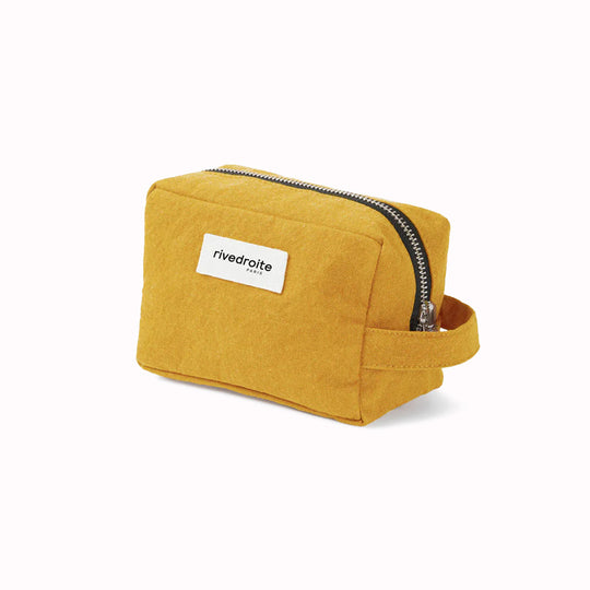 Mustard Tournelles bag from Parasian brand Rive Droite is a compact everyday toiletry make up bag made from re-cycled cotton. Viewed from an angle.