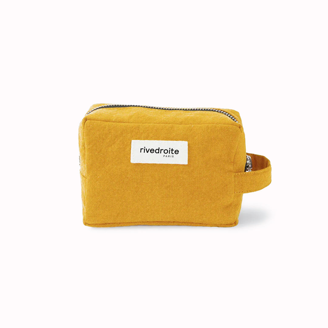 Mustard Tournelles bag from Parasian brand Rive Droite is a compact everyday toiletry make up bag made from re-cycled cotton.