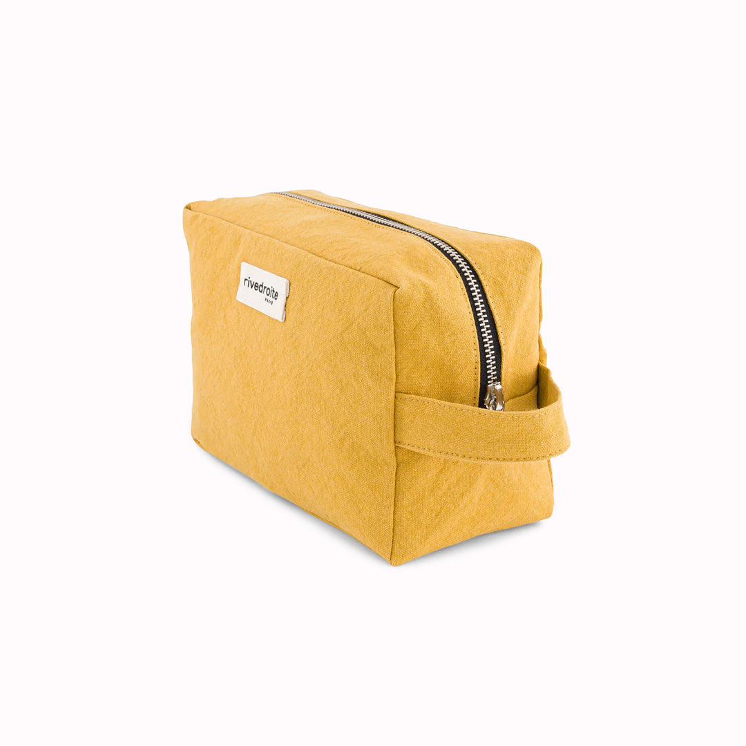 Mustard Tournelles XL. A zippered pouch in a pleasing cube shape which is large enough for essential make up items on a weekend away. Seen at an angle