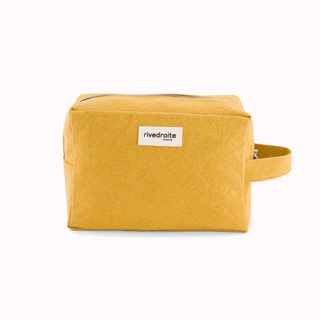 Mustard Tournelles XL. A zippered pouch in a pleasing cube shape which is large enough for essential make up items on a weekend away.