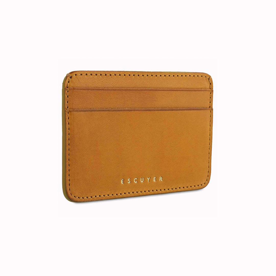 A slim and stylish cardholder from Escuyer, in Mustard yellow leather. The cardholder is handmade by Portuguese artisans, using vegetable-tanned leather from a tannery in Tuscany, Italy.