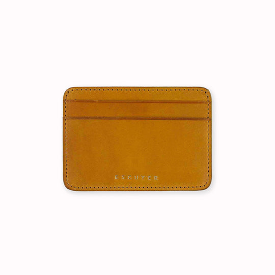 A slim and stylish cardholder from Escuyer, in Mustard yellow leather. The cardholder is handmade by Portuguese artisans, using vegetable-tanned leather from a tannery in Tuscany, Italy.