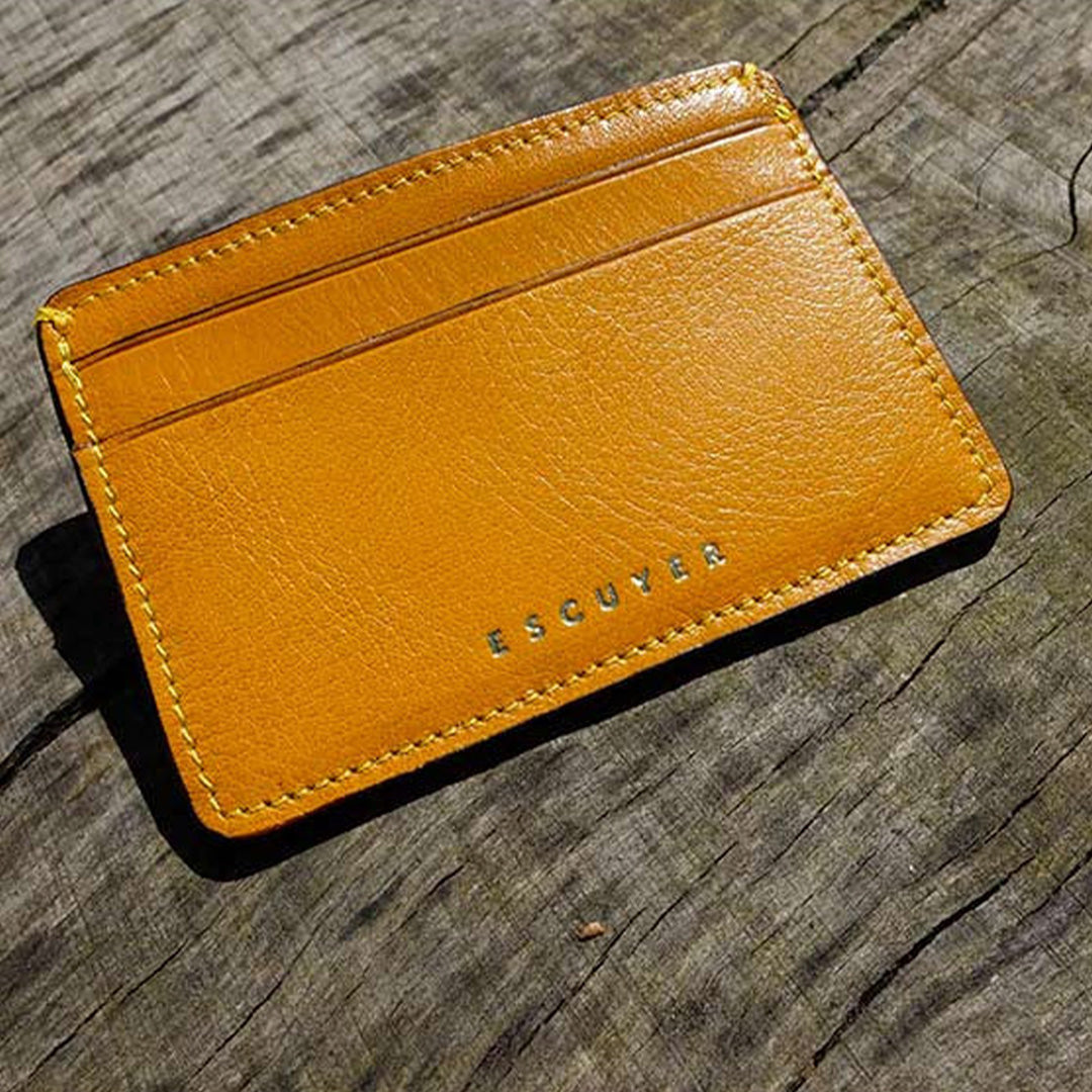 A slim and stylish cardholder from Escuyer, in Mustard yellow leather. The cardholder is handmade by Portuguese artisans, using vegetable-tanned leather from a tannery in Tuscany, Italy.