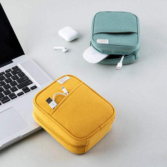 Mustard Yellow pocket cable pouch by Korean stationery brand Livework. Available in a choice of pleasing contemporary colours, the zipped pocket pouch opens up nice and wide, giving easy access to your charger, cables and other small tech items.