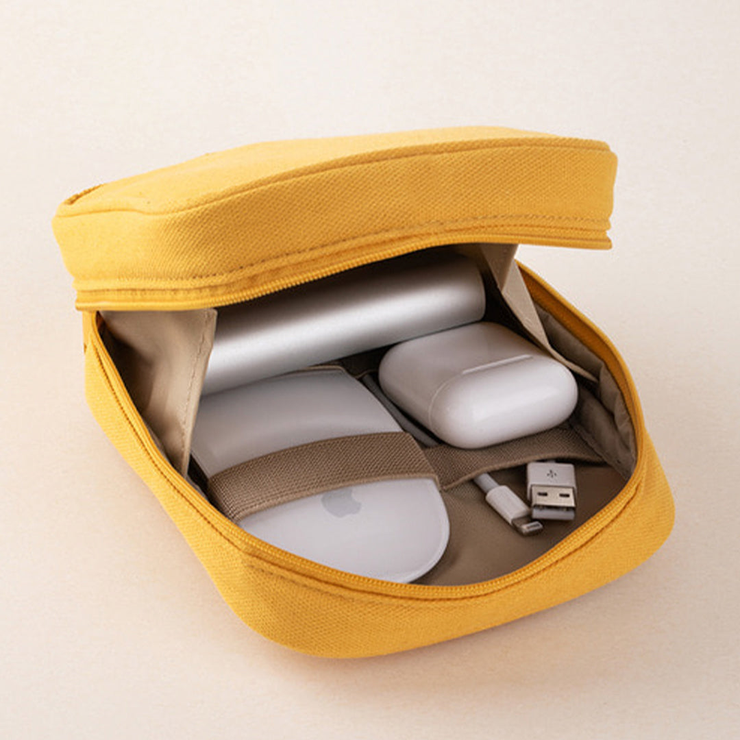 Mustard Yellow pocket cable pouch by Korean stationery brand Livework. Available in a choice of pleasing contemporary colours, the zipped pocket pouch opens up nice and wide, giving easy access to your charger, cables and other small tech items.