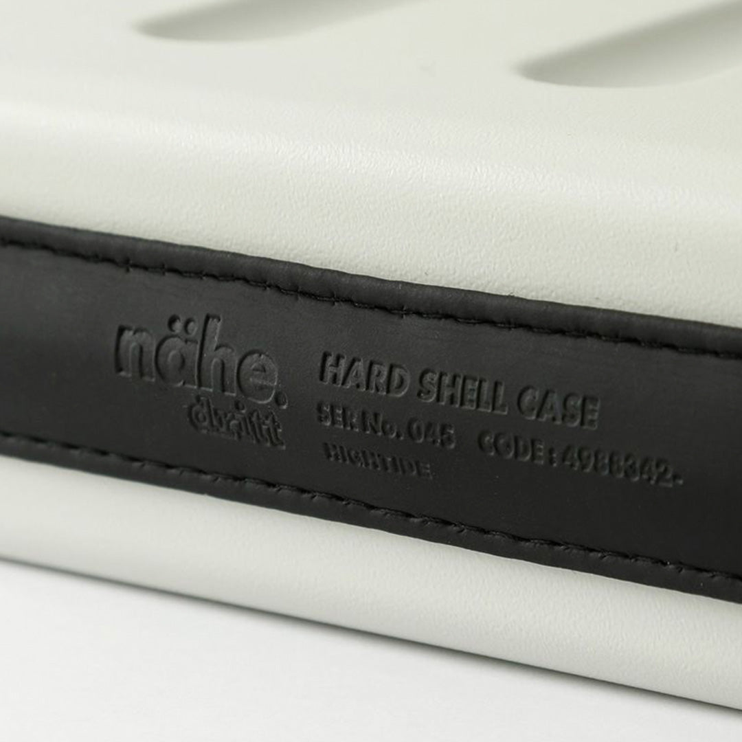 Nahe Hard-Shell Case in bright yellow by Japanese stationery brand Hightide Penco. Detail of Spine