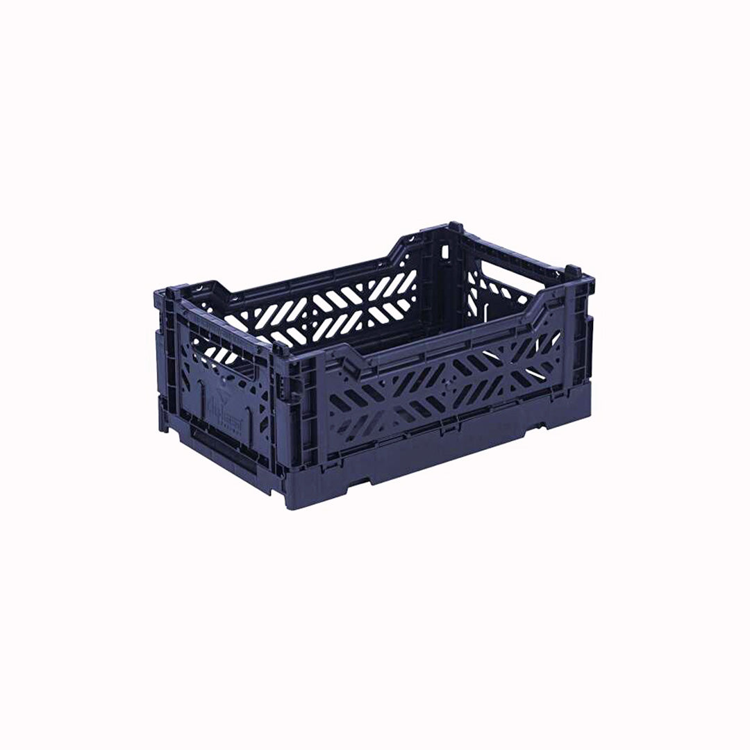 Navy Mini Folding Crate from Aykasa. This crate is made from 100% recyclable material and can be folded flat when not in use. It's perfect for holding books, toys, clothes, or anything else you want to organise. 