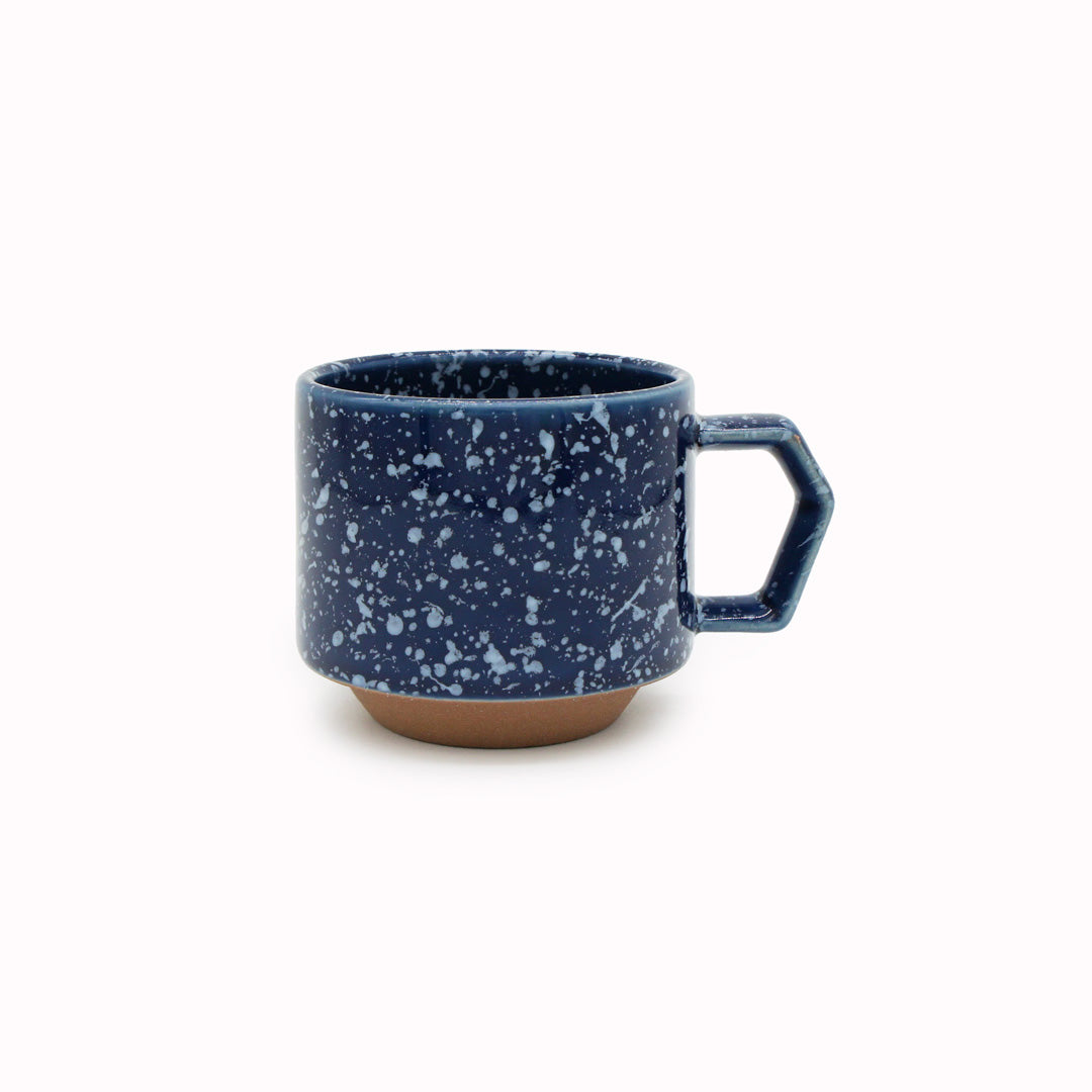 Compact and Easy to hold and stackable for easy storage. This Splash mug has a white glaze playfully sprayed over deep navy with an unglazed base. They are sturdy and comfortable to hold with a unique silhouette.