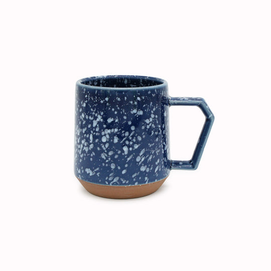 Compact and Easy to hold and stackable for easy storage. This Splash mug has a white glaze playfully sprayed over deep navy with an unglazed base. They are sturdy and comfortable to hold with a unique silhouette.