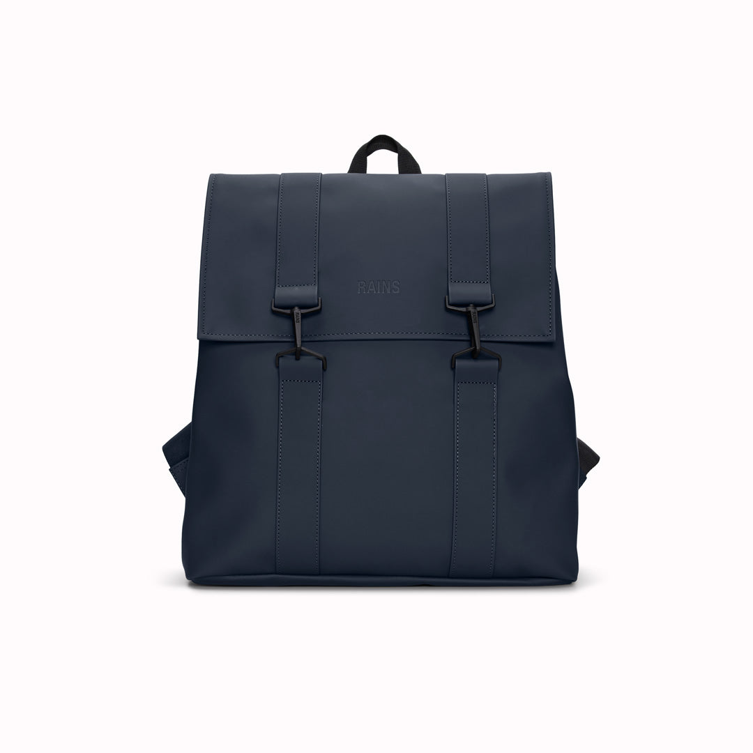 Navy Rains' MSN Bag W3 is their interpretation of the classic school backpack, reimagined for commuters. A minimal silhouette with dual strap and carabiner closure. Made from Rains’ signature waterproof fabric, with an internal laptop pocket and a roomy main compartment.