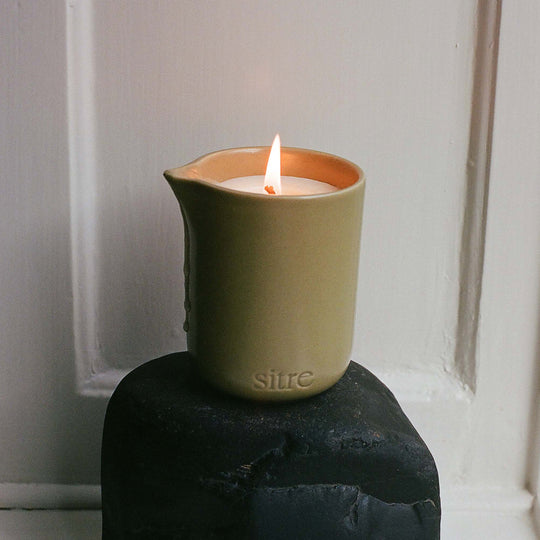 Night Touch is the ultimate mood-setter for a slow evening. This isn't your standard scented candle; it’s a functional piece of self-care designed to melt into a warm, nourishing body oil.