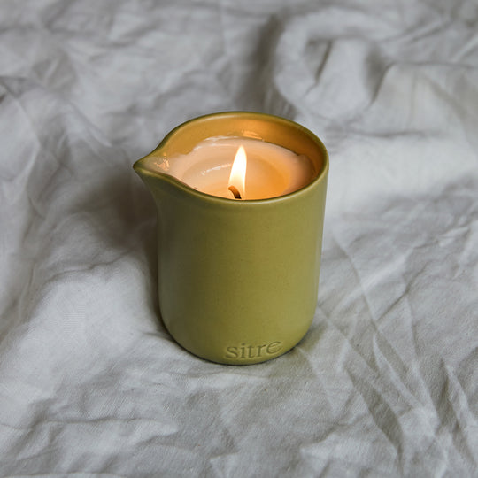 Night Touch is the ultimate mood-setter for a slow evening. This isn't your standard scented candle; it’s a functional piece of self-care designed to melt into a warm, nourishing body oil.