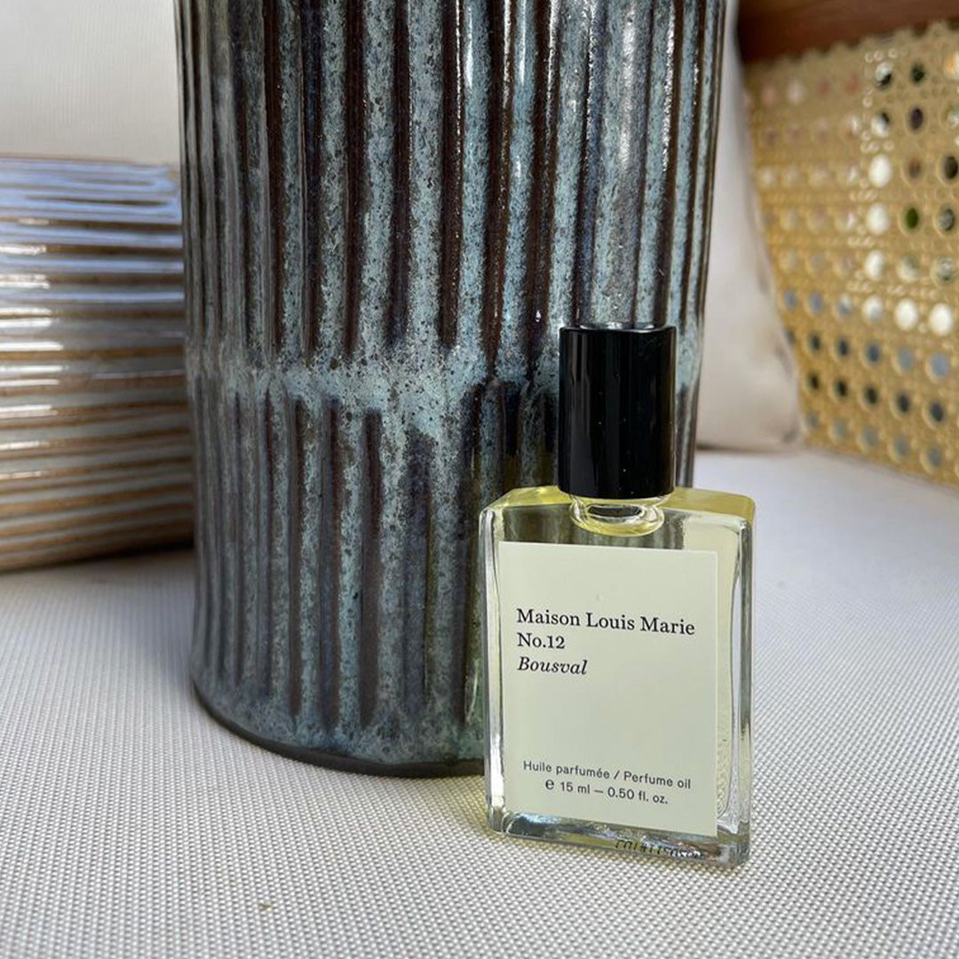 No12 Balincourt Roll on perfume lifestyle image.. Memories for enchanted summers from the founders mother's hometown of Bousval in Belgium make up the fragrance in this fresh and light perfume oil. Italian Bergamot, Valencia Orange, White Ginger Flower are the standout notes along with a little woody muskiness to keep it nice and contemporary. 