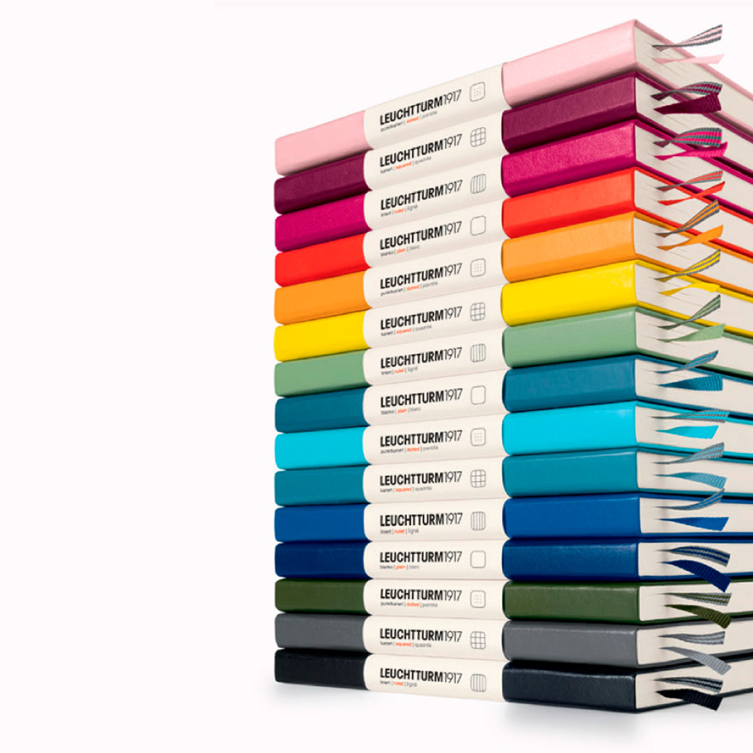 The B6+ Softcover Dotted Notebook features 2 page markers, a blank table of contents, numbered pages, a gusseted pocket for loose notes and business cards, an elastic enclosure band