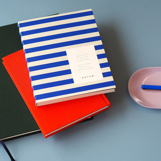 The planner features a minimalist design with a waterproof stripy bright blue and white softcover. The pages are made of high-quality paper that is smooth and acid-free, perfect for writing with any pen or pencil.