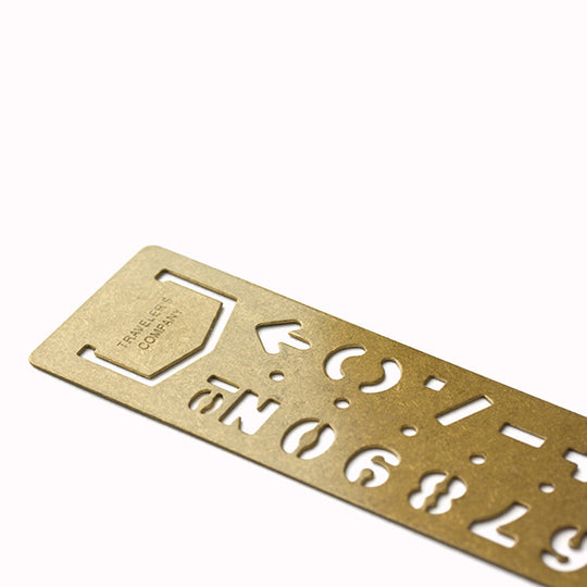 Made from solid brass with a tactile weight and finish, this piece works as both a bookmark and an alphabet template you can slot into your notebook or planner.