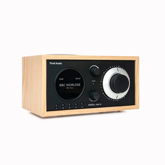 The Model One+ offers a sophisticated blend of classic design and modern audio technology, perfectly suited for any setting. This versatile table radio provides comprehensive listening options, including crystal-clear DAB/DAB+ digital radio, traditional FM, and convenient Bluetooth connectivity for wireless streaming.